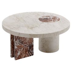 a white marble coffee table with an abstract design