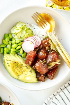 a white plate topped with meat and veggies