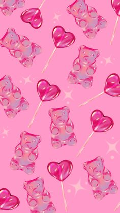 a pink background with lots of hearts and bears on sticks in the shape of heart shaped lollipops