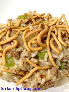 the food is covered with noodles and other toppings