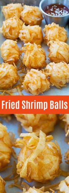 fried shrimp balls on a baking sheet with dipping sauce in the background and text overlay that reads fried shrimp balls