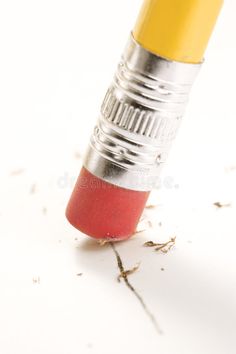 a pencil that is laying on the ground with its end pointing up to it's side