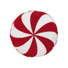 a red and white peppermink pillow on a white background