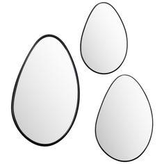 three oval mirrors are shown with black trims on the sides and one has an egg shaped