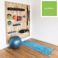 there is a gym ball and exercise mat in this room with the wall behind it