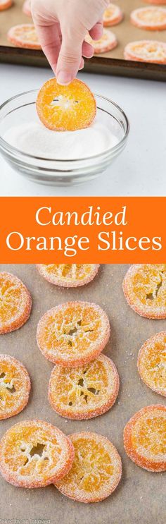 an orange slice is being dunked with powdered sugar and then placed on top of the cookies