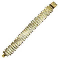 Wonderful Jakob Bengel Art Deco gold tone bracelet with brickwork links and an ornate clasp. Circa 1930s. Measuring length 17.8 cm / 7 inches by width 1.9 cm / .75 inch. The bracelet is in very good condition, there is some wear to the gold tone metal finish. This stylish Jakob Bengel bracelet is very well made, the shiny brickwork links look lovely glinting in the light. Gold Hallmarked Art Deco Jewelry, Art Deco Polished Finish Bracelets As Gift, Art Deco Polished Bracelets For Gift, Collectible Art Deco Bangle Jewelry, Art Deco Yellow Collectible Jewelry, Toggle Clasp Bracelet, Retro Bracelet, Silver Link Bracelet, Amber Crystal