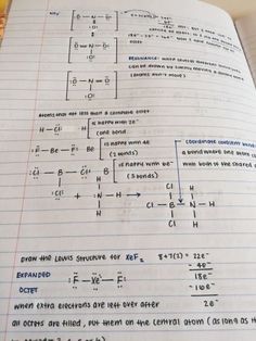 an open notebook with some calculations on it