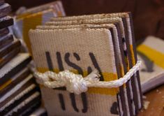 a stack of books sitting on top of a wooden table