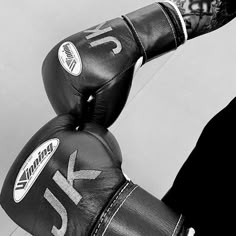 black and white photograph of a man wearing boxing gloves