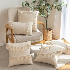 a living room filled with furniture and a potted plant