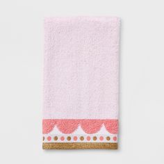 a pink towel with gold trim on the edge and polka dots in the middle, against a white background