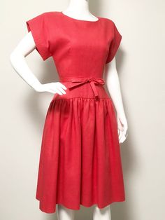 This is a beautifully tailored dress from William Pearson. The color is a vibrant coral. The dress includes a little bow belt which can be removed. There is no fabric tag, but this feels and looks like linen without the wrinkles. I presume it is a blend. The dress is fully lined with shoulder pads and back zipper. Size tag 10, check measurements carefully, no stretch. Measurements taken with dress laying flat and doubled where appropriate. In order to determine fit we recommend comparing measure Coral Red Dress, Vintage Retro Clothing, Career Girl, Bow Belt, Girls Series, Dress Linen, Tailored Dress, Coral Red, Red Outfit