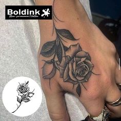 a hand with a rose tattoo on it