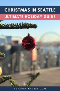 a christmas ornament hanging from a tree with the words christmas in seattle ultimate holiday guide