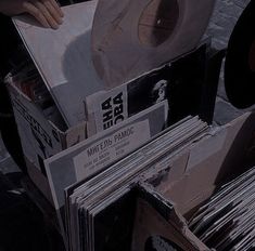 a pile of records sitting on top of each other