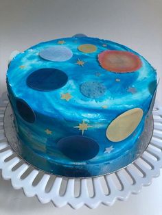 a cake with blue icing and stars on it