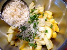 a metal bowl filled with rice and vegetables