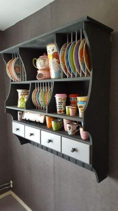 a shelf with cups and plates on it