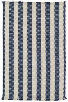 a blue and white striped rug on a white background