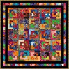 a colorful quilt with lots of different colored squares on the front and back, as well as black border