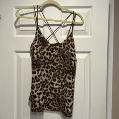 Pair With Jeans & Boots For A Sexy Cool Vibe. Fitted Leopard Print Cami Tank Top, Fitted Strappy Tank Top For Night Out, Leopard Print Top With Built-in Bra For Night Out, Fitted Leopard Print Camisole With Spaghetti Straps, Sleeveless Leopard Print Top For Night Out, Fitted Leopard Print Camisole, Leopard Print Sleeveless Top With Built-in Bra, Sleeveless Leopard Print Top With Built-in Bra, Stretch Leopard Print Tops With Built-in Bra