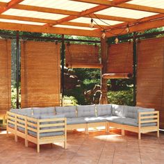 an outdoor seating area with wooden blinds on the windows