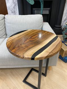 a wooden table sitting on top of a white couch