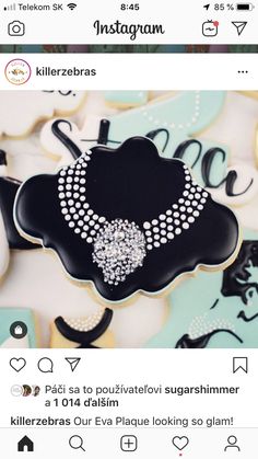 a black and white necklace on top of a cookie sheet with the words instagram