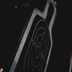 a close up shot of a target in the air with an arrow pointing at it