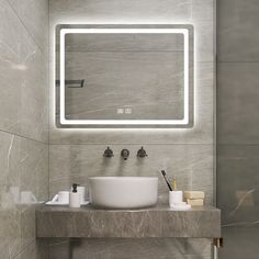 a bathroom with a sink, mirror and soap dispenser on the counter