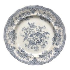 an old blue and white plate with floral designs on it, against a white background