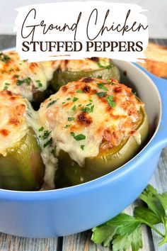 stuffed peppers in a blue casserole dish with cheese and parsley on top