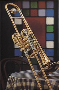 a brass trumpet sitting on top of a table