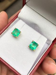 Featured here is a beautiful set of emerald cut Colombian emerald studs in fine 14K yellow gold. Displayed are medium-green emeralds with very good transparency, accented by a simple four-prong 14K gold mount, allowing for the emerald to be shown in full view. The earth mined, green Colombian emeralds have a desirable lush green color with excellent qualities. These earrings are ideal for everyday use and are the perfect accessory to any outfit. Total Carat Weight: 2.0cts Setting Style: Four Pro Green Baguette Cut Earrings For Gifts, Baguette Cut Emerald Earrings As A Gift, Emerald Cut Green Gemstone Earrings, Emerald Cut Green Earrings, Fine Jewelry Emerald Cut May Birthstone Earrings, Fine Jewelry Emerald Cut Earrings For May Birthstone, Fine Jewelry Baguette Cut Emerald Earrings, May Birthstone Emerald Cut Fine Jewelry Earrings, Rectangular Emerald Earrings Fine Jewelry