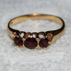 3 Stones Of Garnet Set In 14k Gold Size 4 Classic Gold Ruby Ring With Three Stones, Classic Three Stone Ruby Ring In 14k Gold, Classic 14k Gold Three-stone Ruby Ring, Classic 14k Gold Three Stone Ruby Ring, Formal Three Stone Garnet Jewelry, Garnet Ring, Garnet Rings, Womens Jewelry Rings, Red Gold