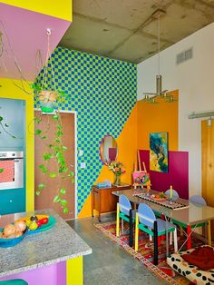 a room with colorful walls and furniture in it