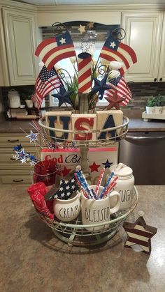 a basket with patriotic decorations on top of a kitchen counter