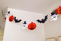 halloween decorations are hanging on the wall