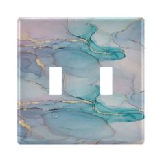 a light switch cover with blue and gold marble