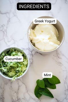 ingredients for greek yogurt and cucumber in small bowls on a marble countertop