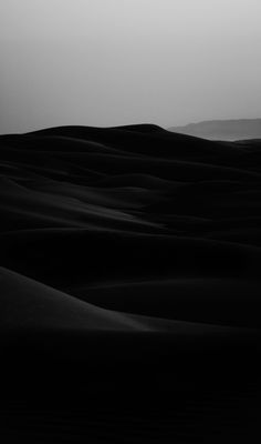 a black and white photo of the desert