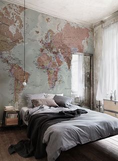 a bedroom with a map on the wall