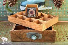 a wooden box filled with lots of different types of items and sitting on top of a tiled floor