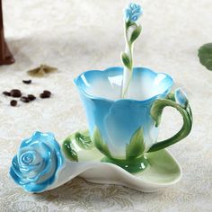 a tea cup and saucer sitting on a table