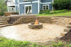 an outdoor fire pit with steps leading up to it