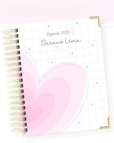 a spiral notebook with hearts on the cover