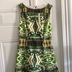 Never Worn Alice And Olivia Cocktail Dress. Garden Print, Boat Neck, Structured Skirt. Elegant Green Printed Dresses, Green Floral Print Sheath Dress, Lined Green Mini Dress For Garden Party, Green Lined Mini Dress For Garden Party, Green Lined Sheath Dress, Green Silk Sleeveless Mini Dress, Green Sleeveless Silk Mini Dress, Sorority Dresses, Structured Skirt