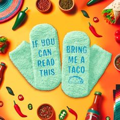 two oven mitts that say if you can read this, bring me a taco