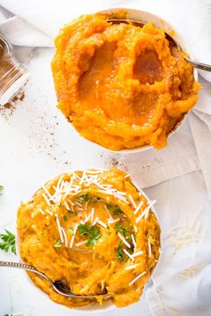 two bowls of mashed sweet potatoes with parmesan cheese and parsley on top